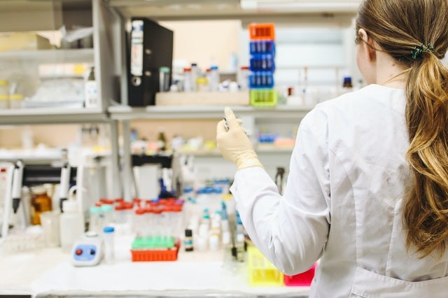 Woman in a white lab coat in a lab